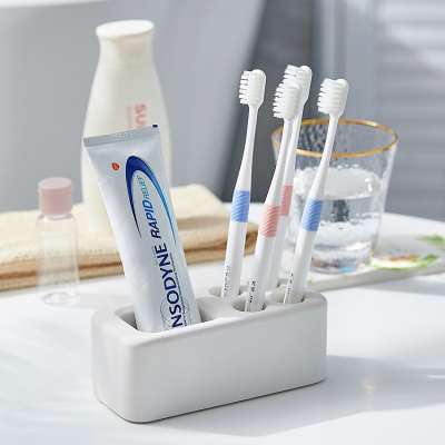 Water absorption anti-bacterial diatomite toothbrush multifunction holder